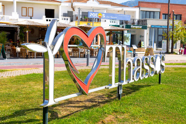 Hand painted wooden directional signs attached to a vine on the Cote d'Azur for Mediterranean resort towns and villages, Sainte Maxime, Gassin and St Tropez