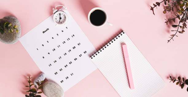 istock Monthly calendar and blank planning notebook on the desktop top view web banner 2205353391
