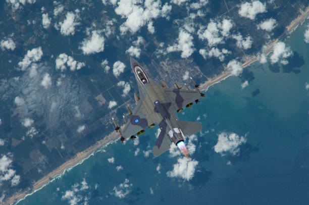 istock F-16 jet fighter flying over the sea 2205354518