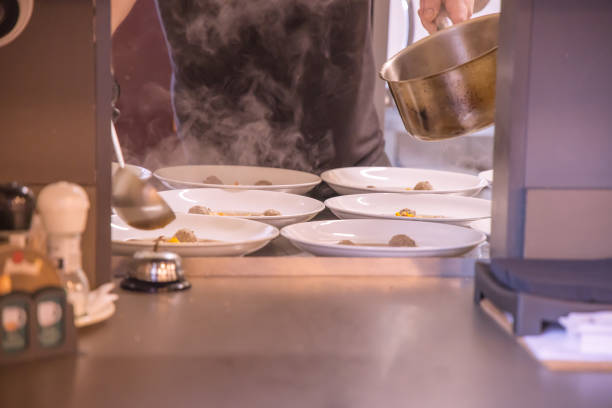 istock Dumpling soup being prepared for serving at a restaurant on a wedding table 2205360429