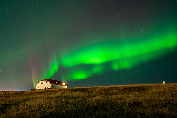 istock Northern Lights above an isolated house 2205360546