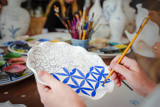 Hand-Painted Ceramic Art – Crafting Traditional Floral Designs stock photo