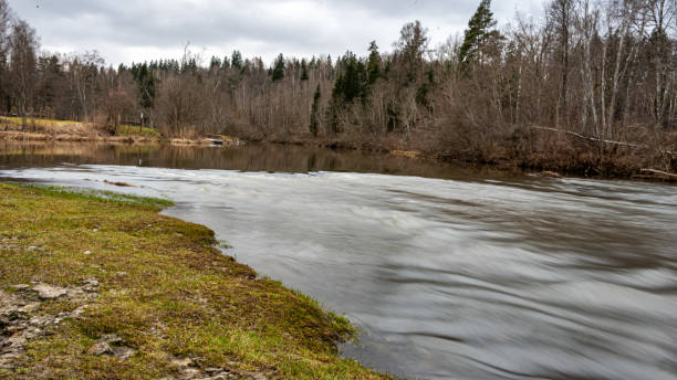 istock Slow water flow in the river, spring in nature 2205365422