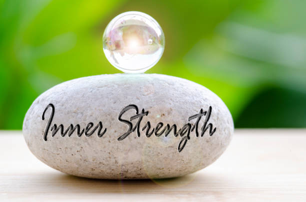 istock Close up of Zen stone with Inner Strength text on the stone. Inner strength concept 2205366156