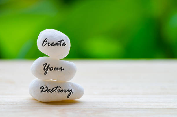 istock Create your destiny text on the white Zen stones. Life destiny concept 2205366167