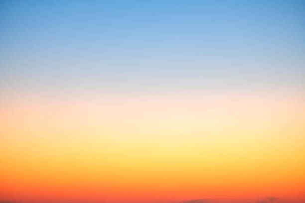 istock Sky,sunset, beautiful , luxury soft gradient orange gold clouds and sunlight on the blue sky perfect for the background, Sunrise on morning or everning in winter warm time ,Twilight summer,silhouette 2205366284