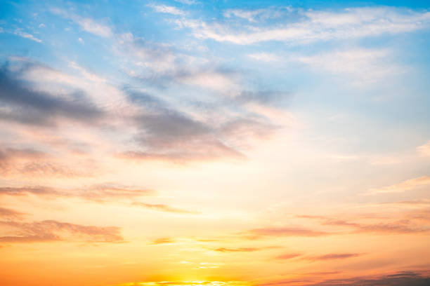 istock Sky,sunset, beautiful , luxury soft gradient orange gold clouds and sunlight on the blue sky perfect for the background, Sunrise on morning or everning in winter warm time ,Twilight summer,silhouette 2205366323