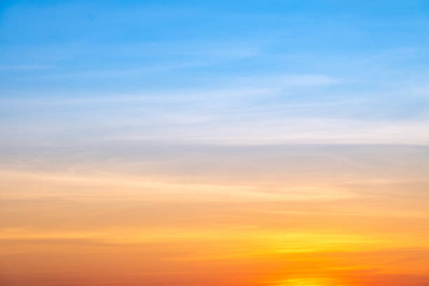 Sky,sunset, beautiful , luxury soft gradient orange gold clouds and sunlight on the blue sky perfect for the background, Sunrise on morning or everning in winter warm time ,Twilight summer,silhouette