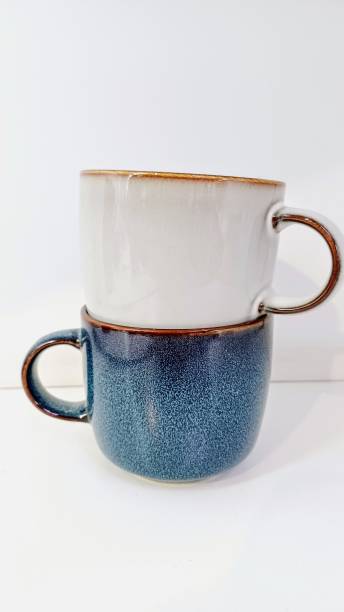 istock Elegant white and navy blue cups for tea. Creative food composition 2205372121