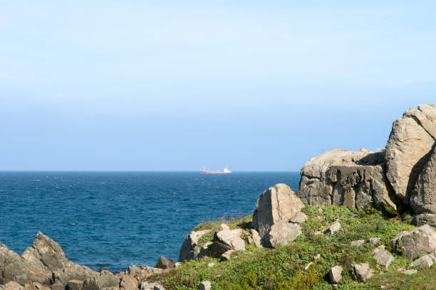istock ship and sea over the cliff 2205372277