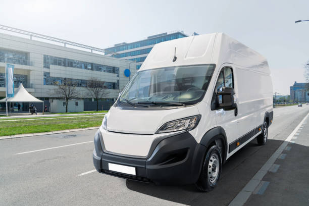istock White delivery van on city street 2205376421