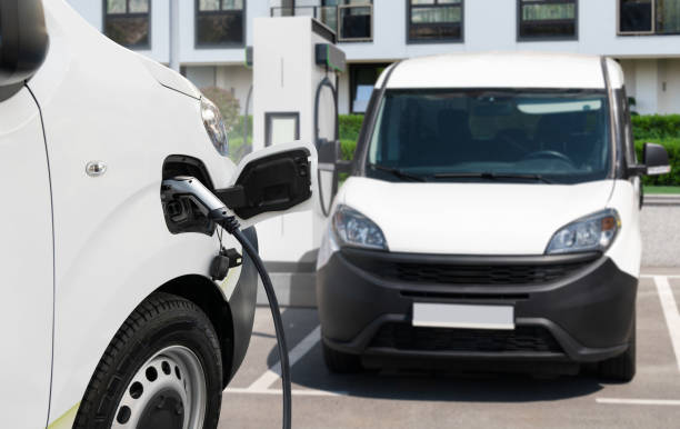 istock Electric delivery van with charging station 2205376453