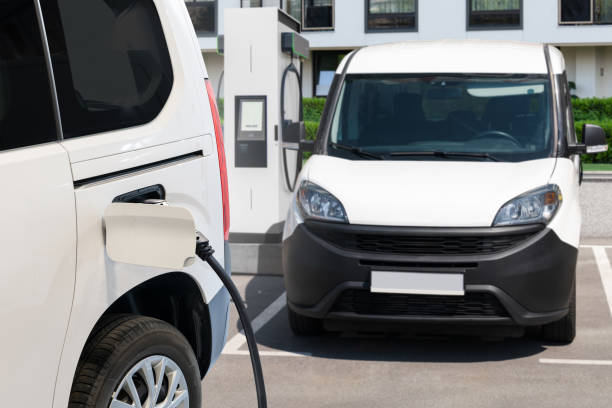 istock Electric delivery van with charging station 2205376585