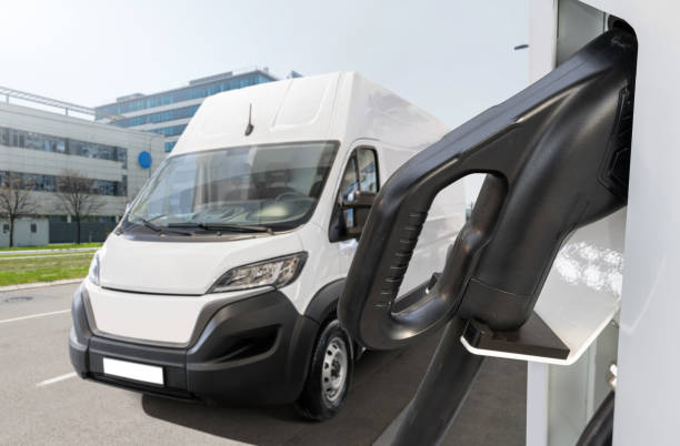 istock Electric delivery van with charging station 2205377083