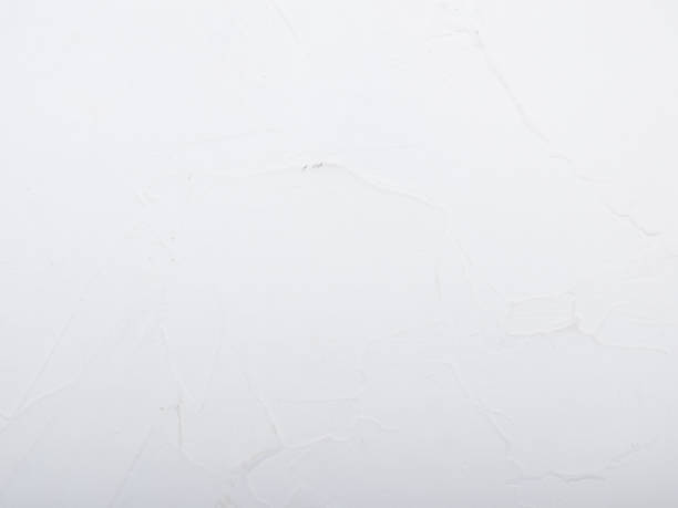 istock Rough white painted wood surface with visible grain and brush strokes, offering a rustic and clean background ideal for product mockups, country-style design, or minimal visuals 2205377588