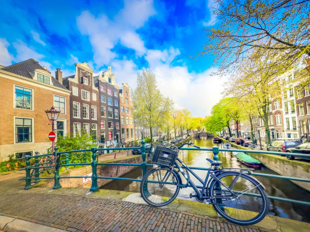 Facades of old historic Houses over canal water, Amsterdam, Netherlands