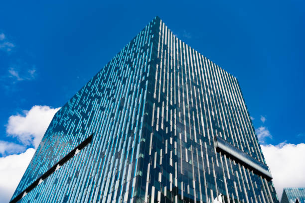 Architectural building business area. Glass skyscraper. City architecture. Architecture of office building. Perspective skyscraper. Business skyscraper building. Futuristic glass structure.