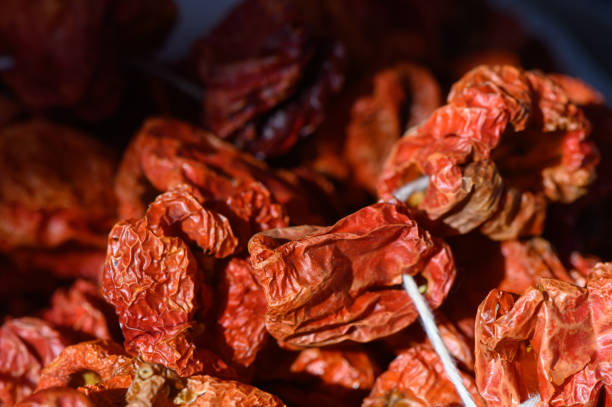 istock Dried red peppers basking in sunlight, showcasing vibrant colors and unique textures in a quaint kitchen 2205379536