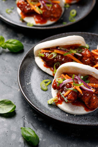 istock Korean Fried Chicken Bao Buns with vegetables. Asian fast food 2205382152
