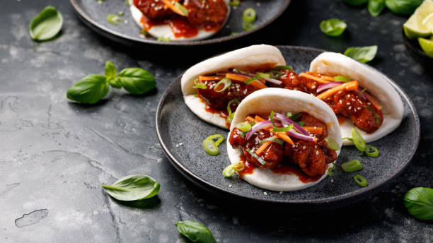 istock Korean Fried Chicken Bao Buns with vegetables. Asian fast food 2205382157