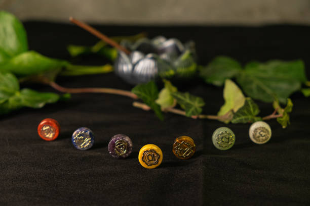 istock Healing crystals arranged in chakra colors with natural elements around them 2205383187