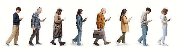 istock Group of ordinary people looking at their smartphone display 2205383390