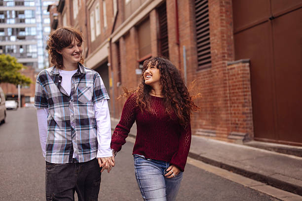 istock Gen z couple walking on a street 2205383556
