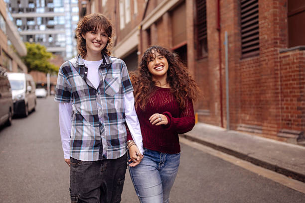 istock Gen z couple walking on a street 2205383562