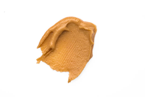 istock Delicious and healthy peanut butter on white background 2205383625