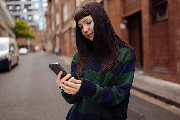 istock A young girl with phone 2205384940