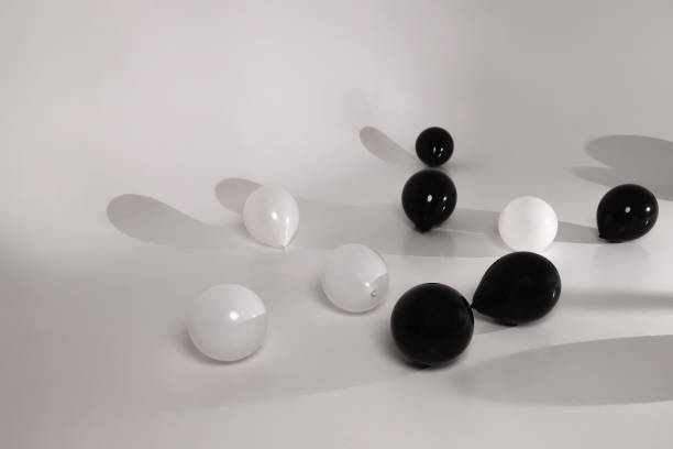 istock Minimalist Black and White Balloons on a Neutral Background 2205385787