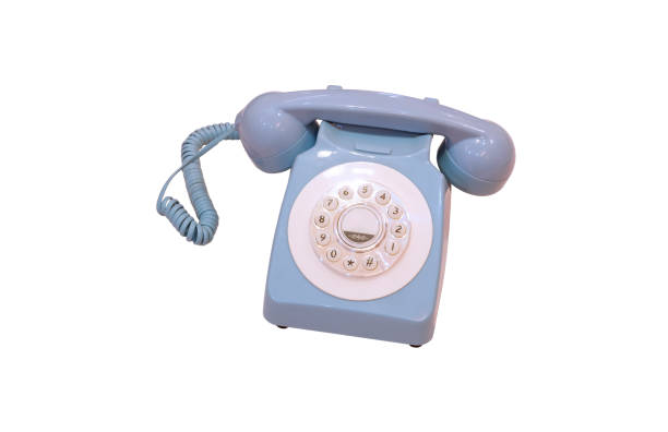 istock The old vintage pastel blue dial telephone isolated on white background with clipping path 2205386097