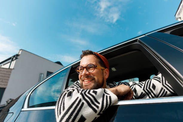 istock Happy Tourist Enjoying Car Ride 2205387561