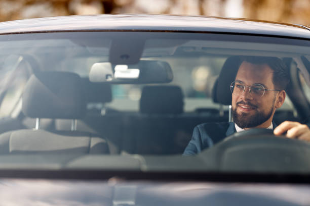 istock Businessman Driving Car 2205387564