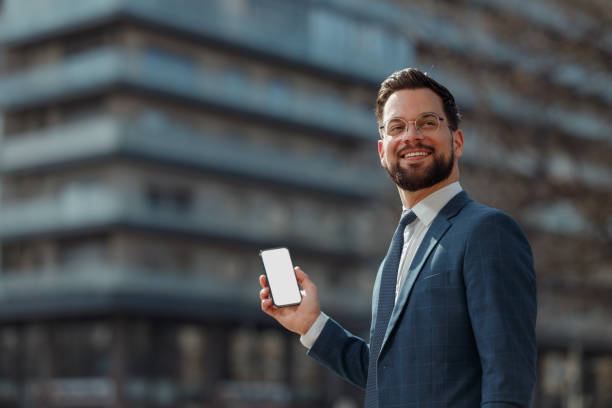 istock Businessman Showing Smartphone Screen 2205387581