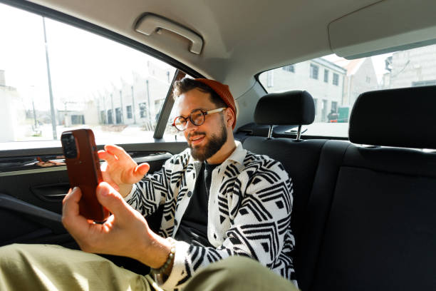 istock Man Having Video Call in Car Backseat 2205387585