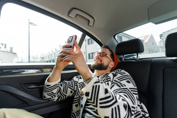 istock Man Having Video Call in Car Backseat 2205387593