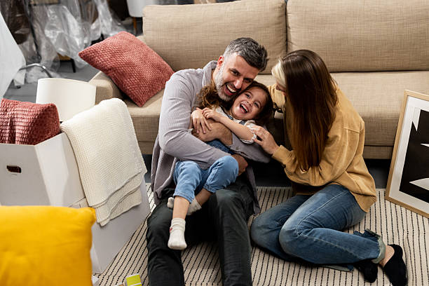 istock Happy family turning the moving process into an enjoyable experience 2205388716