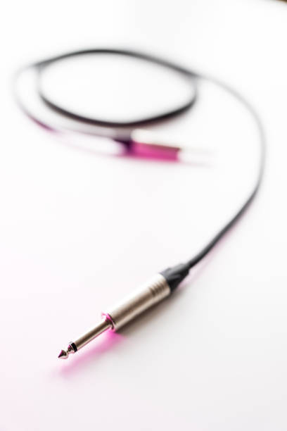 A collection of yellow, red, and blue audio and video connectors lies on a white surface, showcasing their different colors and types. The cables are neatly arranged for easy access.