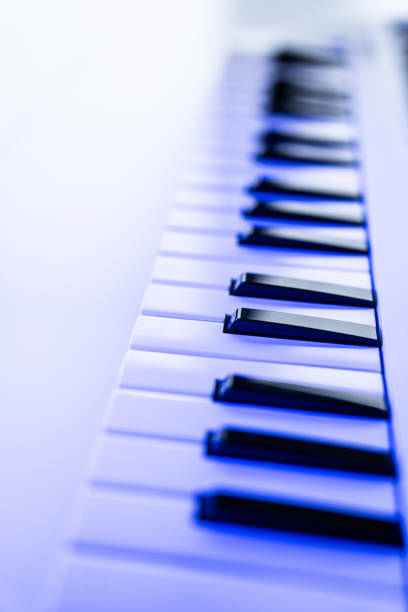 Close-up of a digital keyboard with black and white keys, captured with a shallow depth of field.