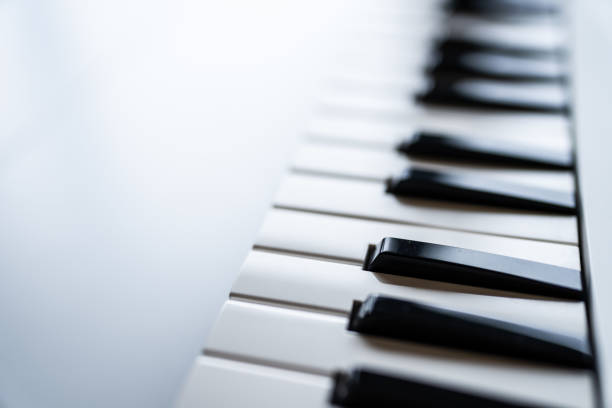 Close-up of a digital keyboard with black and white keys, captured with a shallow depth of field.