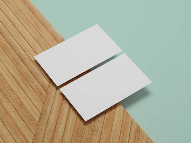 istock Clean business card mockup positioned on textured wood, great for visualizing branding and identity projects. 2205390175