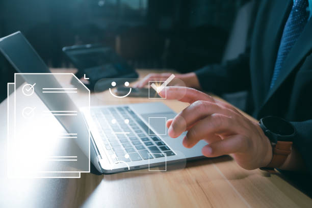 istock Business performance checklist, businessman using laptop doing online checklist survey, filling out digital form checklist, take an assessment, questionnaire, evaluation, online survey, online exam. 2205391092