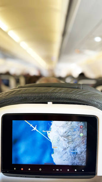 A plane cabin and screen about to arrive at Mecca