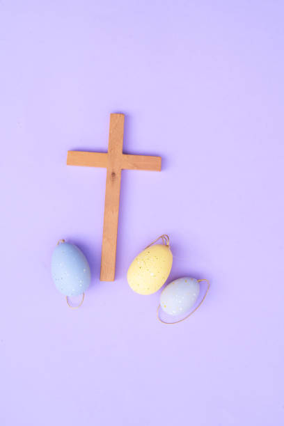 istock Wooden cross with painted eggs 2205391422