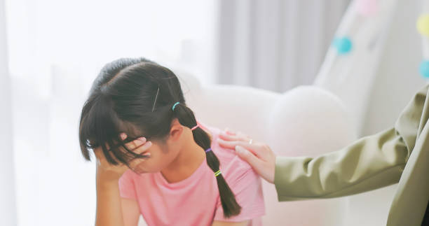 istock asian counselor comforting sad kid 2205391424