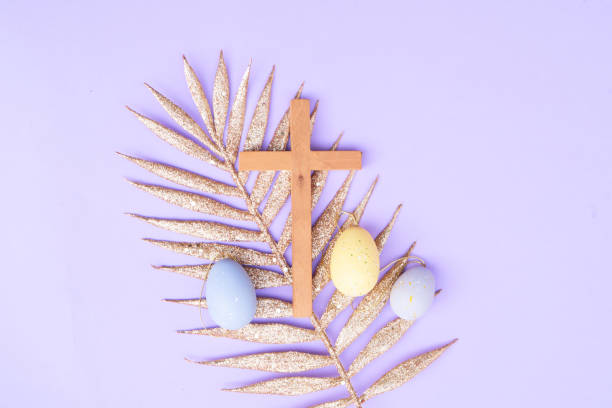 istock Wooden cross with painted eggs 2205391448