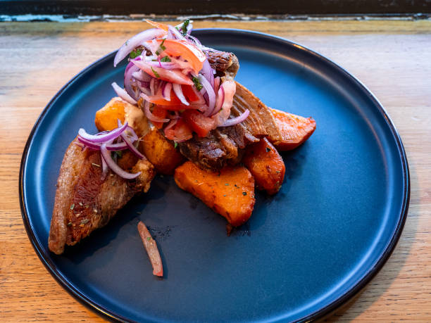 istock peruvian Chicharron de cerdo simmered pork belly 2205391633