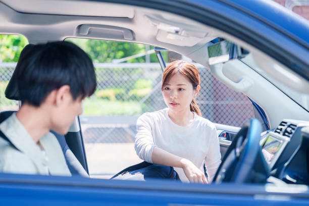 istock Young husband driving his wife home 2205392836