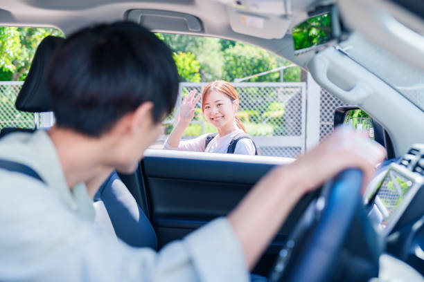 istock Young husband driving his wife home 2205392846